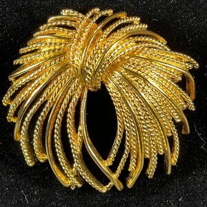 Monet Gold tone Mirador Brooch Pin Signed Vintage Burst Textured Tassel Rope Bow